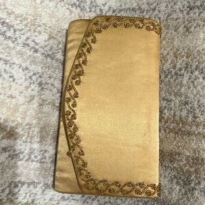 Gold evening clutch with beaded decor